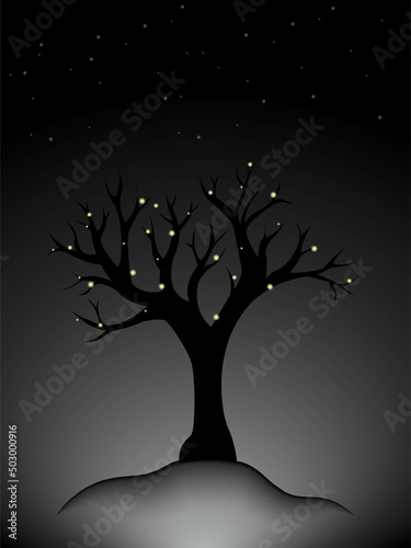 Silhouette of a tree in the fog at night © AnnSky