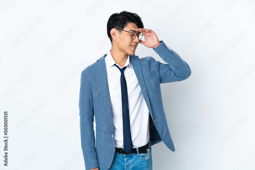 Young Chinese business man isolated on white background smiling a lot Young Chinese business man isolated on white background smiling a lot