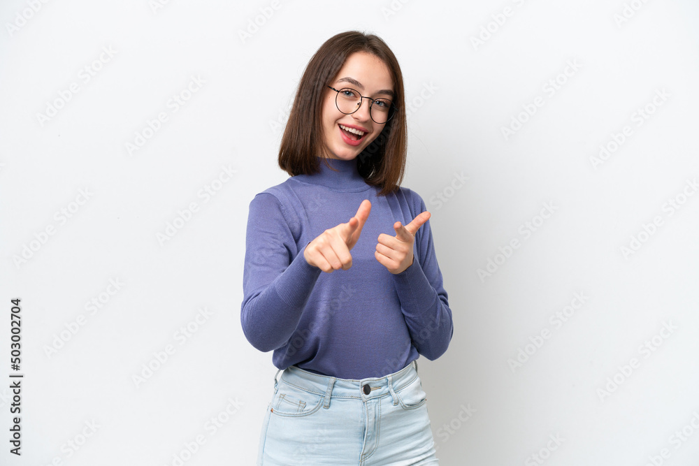 Young Ukrainian woman isolated on white background surprised and pointing front