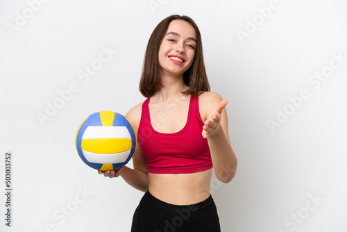 Young Ukrainian woman playing volleyball isolated on white background shaking hands for closing a good deal