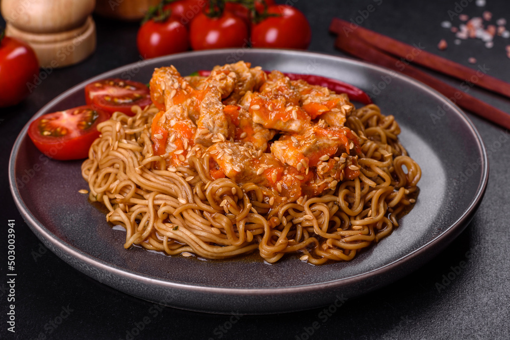 Thai noodle and chicken plate on a black concrete background with Chinese chopsticks and copy space Thai noodle and chicken plate on a black concrete background with Chinese chopsticks and copy space