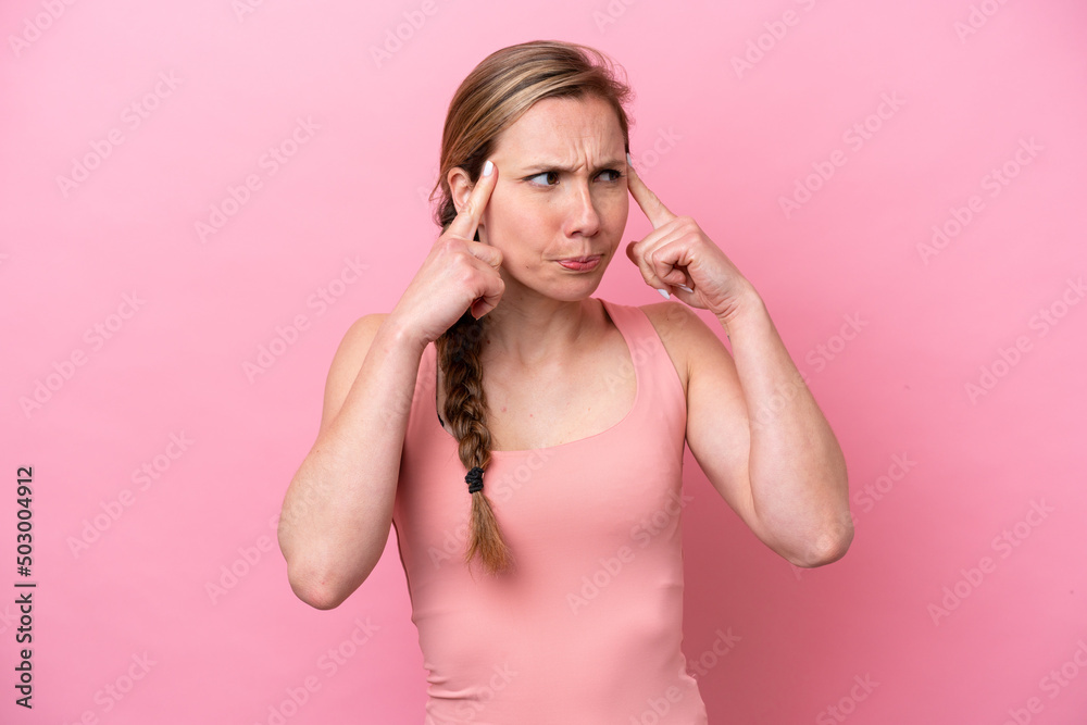 Young caucasian woman isolated on pink background having doubts and thinking Young caucasian woman isolated on pink background having doubts and thinking