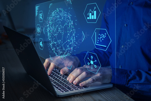 Big data and analytics visualization technology with scientist analyzing information structure on screen with machine learning to extract predictions for business, finance, internet of things