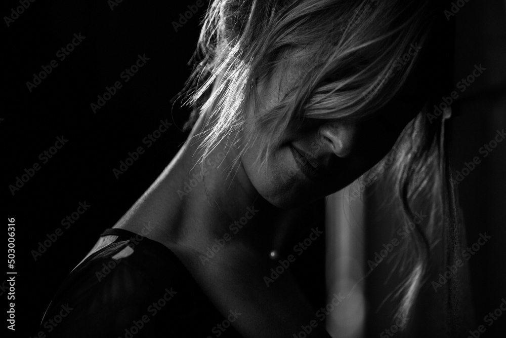 woman face with short сurling  blonde hair black and white beauty  portrait on background