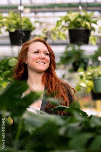 woman in a garden with red hair and blue eyes