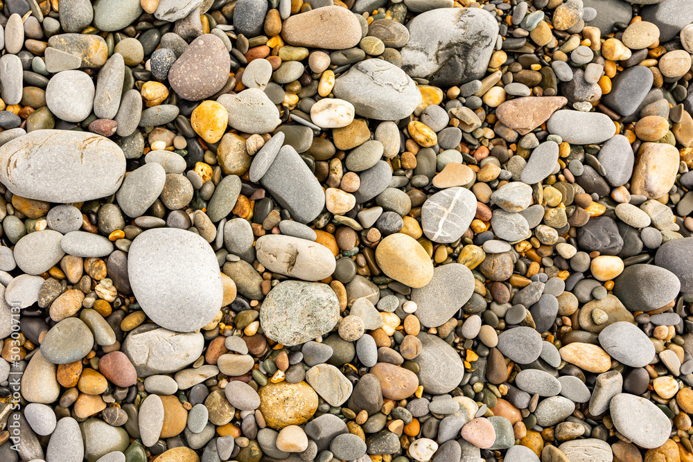 from above close up of beach pebbles and stones from above close up of beach pebbles and stones