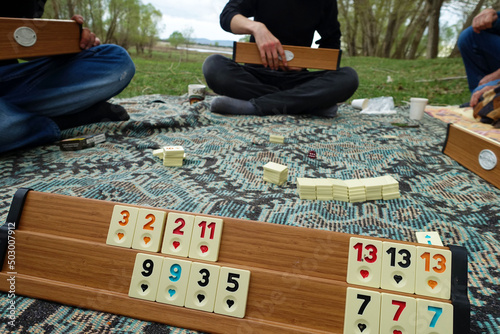 spending time playing okey at the picnic, close-up of the okey game and stones,