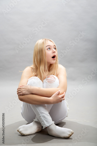 the surprised girl looks up