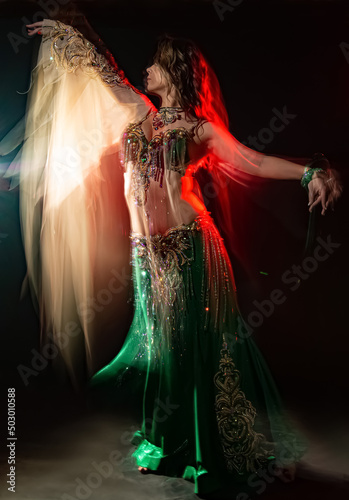 Young woman dancing belly dance