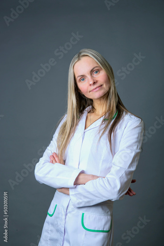 A competent woman in a white coat