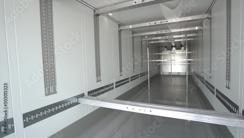 cargo empty semi-trailer with clean floor, rear close-up