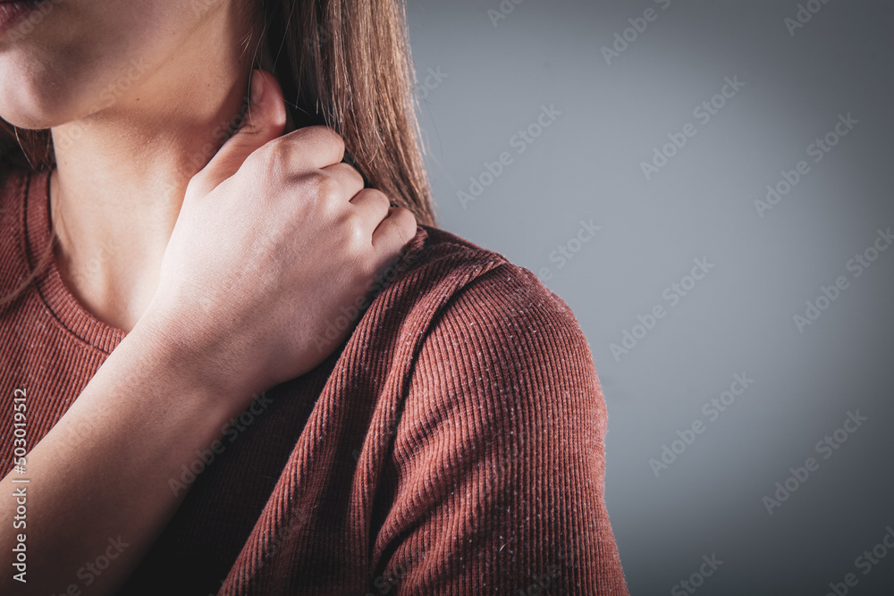 close-up on a woman's hand massaging her neck. Girl's neck hurts close-up on a woman's hand massaging her neck. Girl's neck hurts