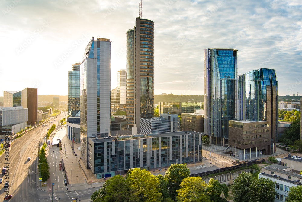 Beautiful aerial evening view of Vilnius business district with scenic sunset illumination. - obrazy, fototapety, plakaty 