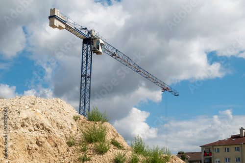 Construction site with construction crane on a sunny day