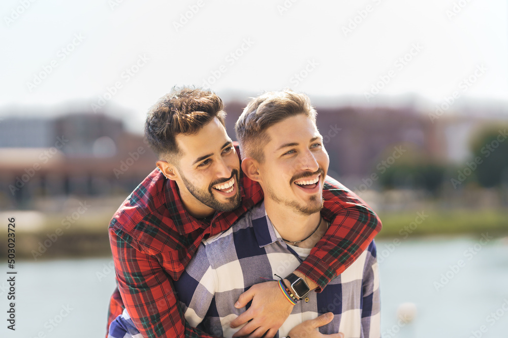 gay couple hugging and laughing