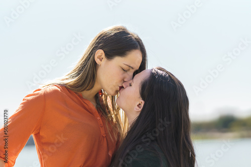 lesbian couple kissing on the lips