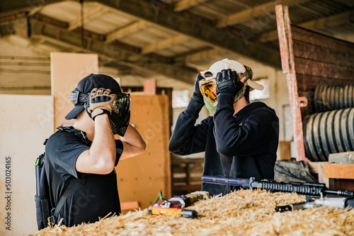 Airsoft soldiers preparing for battle at training ground