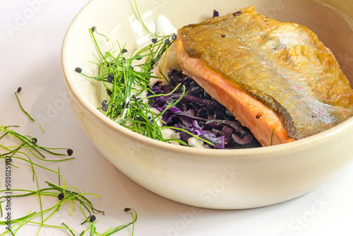 Billede på lærred Char fish filet roasted on the skin with red cabbage kimchi, cream sauce and spr