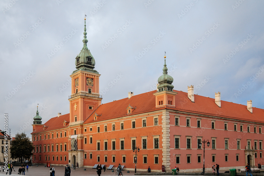 Warsaw, Poland, 13 October 2021: Royal Castle with clock tower in old town, residence official home of Polish monarchs, fortified complex at sunny autumn day, Main square with Sigismund Column