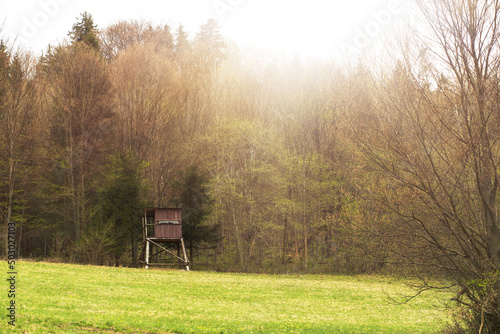 Hunting tower on the green meadow.Spring season.