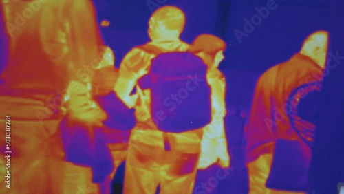 Infrared thermal vision of random walking people. Thermal vision of crowds. photo