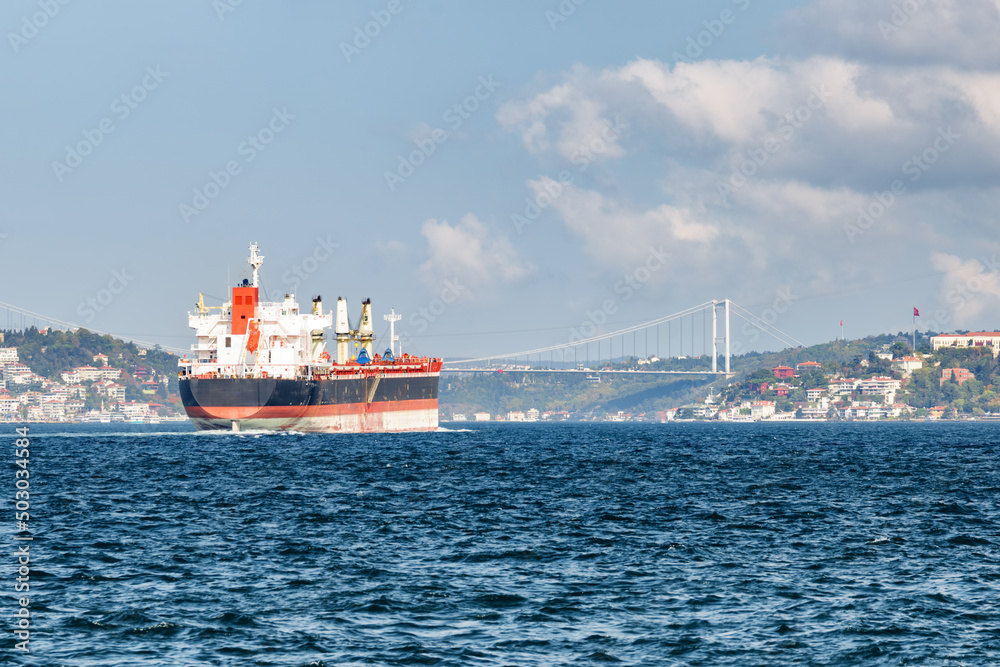 Tanker passes through the Bosporus. View of the Bosphorus Bridge