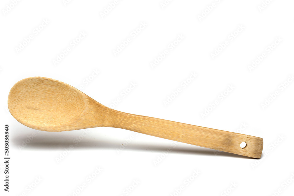 Closeup light wooden cooking spoon white background Closeup light wooden cooking spoon white background