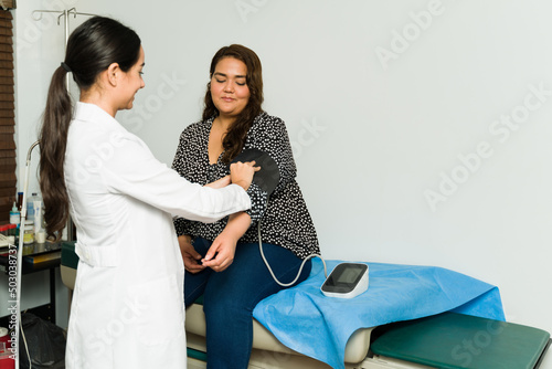 Obese woman getting a check-up photo