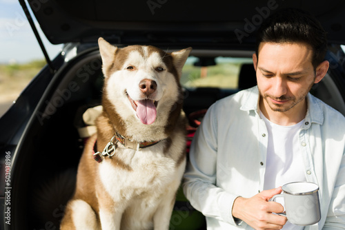 Attractive man relaxing in the car with his dog © AntonioDiaz