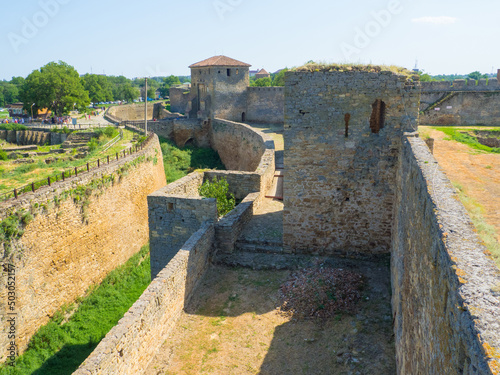 Belgorod Dniester fortress. The ruins of medieval Akkerman Fortress, Bilhorod Dnistrovskyi, Ukraine. Ruins of the citadel. Defensive moat of the stronghold on a sunny summer day.