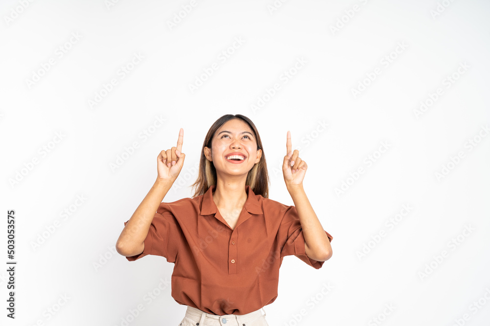 attractive asian woman with finger pointing up hand gesture on isolated background attractive asian woman with finger pointing up hand gesture on isolated background