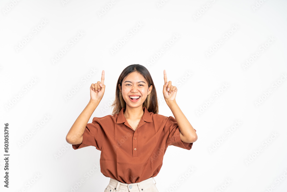 attractive asian woman with finger pointing up hand gesture on isolated background