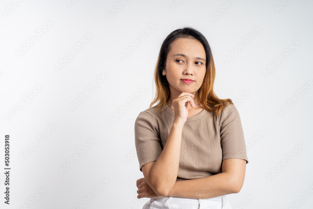 Young asian woman thinking gesture. beautiful woman on isolated background with thoughtful expression Young asian woman thinking gesture. beautiful woman on isolated background with thoughtful expression