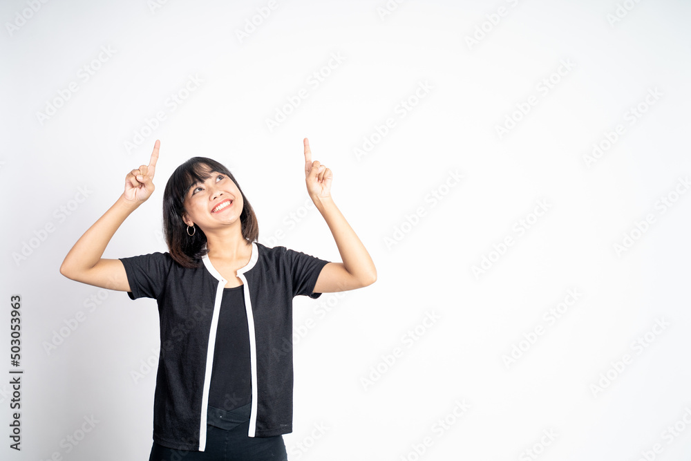 attractive asian woman with finger pointing up hand gesture on isolated background attractive asian woman with finger pointing up hand gesture on isolated background