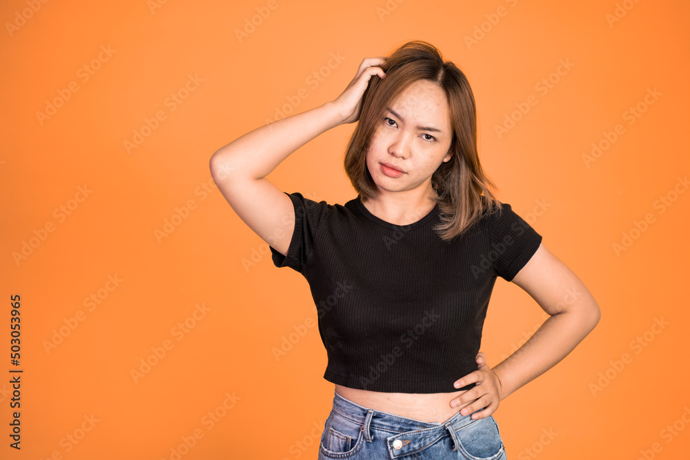 Thoughtful Asian woman poses against isolated background. girl looks confuse and thinking Thoughtful Asian woman poses against isolated background. girl looks confuse and thinking