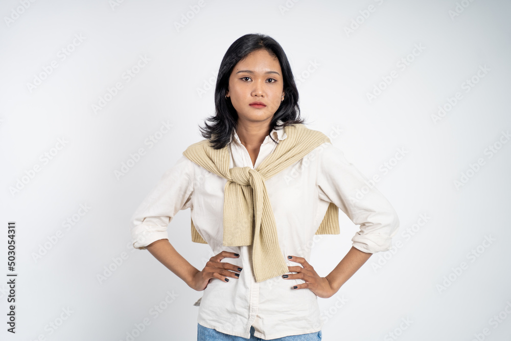 serious expression portrait of young asian woman over isolated background feeling uncertain serious expression portrait of young asian woman over isolated background feeling uncertain