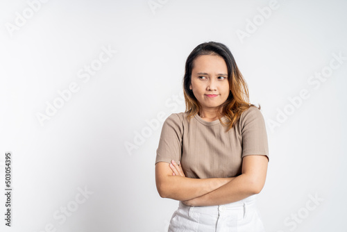 young woman stand cross hand with unhappy sad face on isolated background