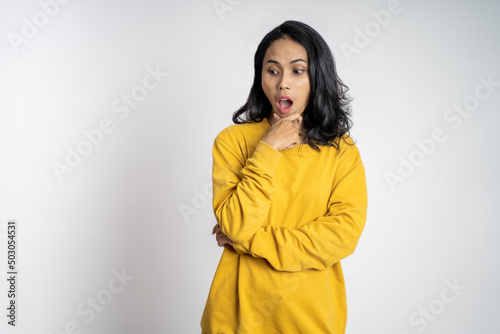 portrait of young asian woman feeling shocked and suprised over isolated background © Odua Images