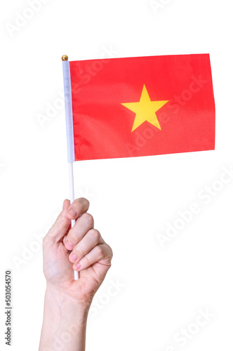A hand holds the flag of Vietnam against a white isolated background. © beast01
