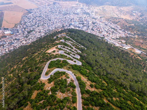 Aerial view of mountain road serpentines on mount Tabor.