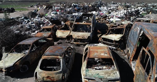 Wallpaper Mural Technology cemetery. Abandoned cars of civilians during the evacuation of the city during the bombing of the city of Bucha. War in Ukraine. Aerial Torontodigital.ca