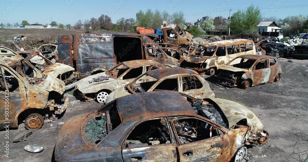 Technology cemetery. Abandoned cars of civilians during the evacuation of the city during the bombing of the city of Bucha. War in Ukraine. Aerial Technology cemetery. Abandoned cars of civilians during the evacuation of the city during the bombing of the city of Bucha. War in Ukraine. Aerial
