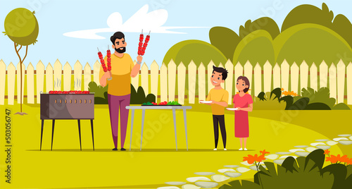 Family summer BBQ picnic in backyard, father holding skewers, kids standing with plates