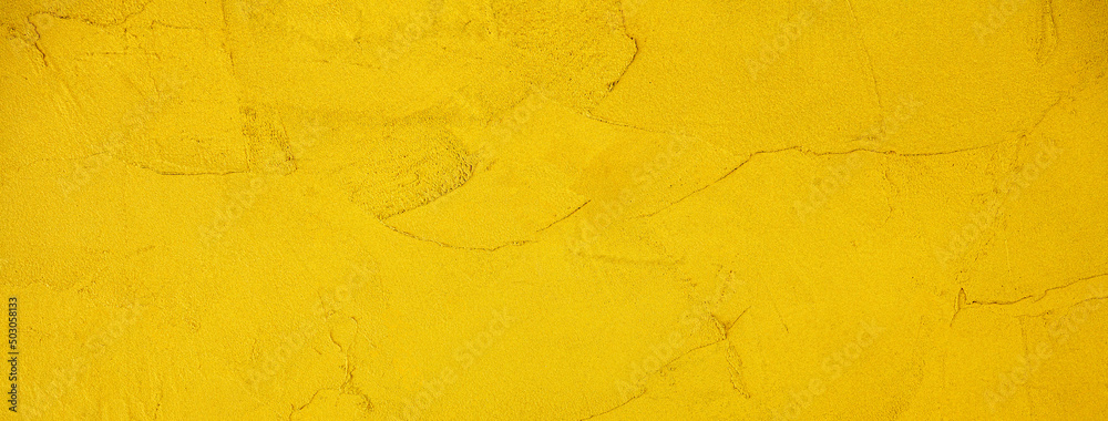 黄色くペイントされた壁の背景テクスチャー