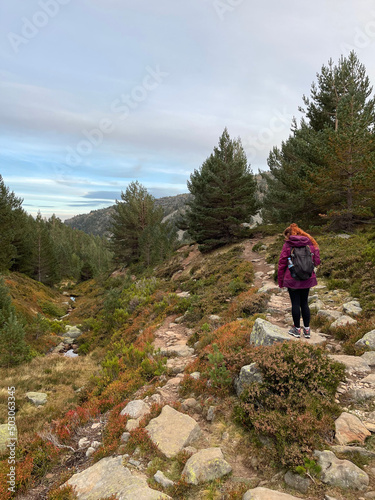 Vertical shot of a person hiking in Laguna Negra, Picos de Urbion photo