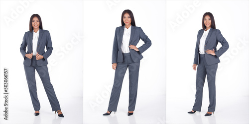 Full length Portrait of 20s Asian business Woman black short hair white shirt gray suit pant shoes photo