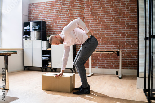 Vászonkép Lifting Heavy Box With Back Pain