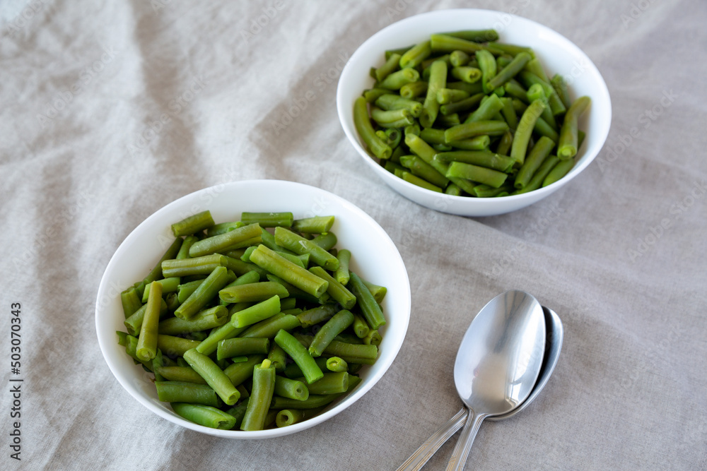 Steamed Green Beans in a White Bowl, low angle view. Steamed Green Beans in a White Bowl, low angle view.