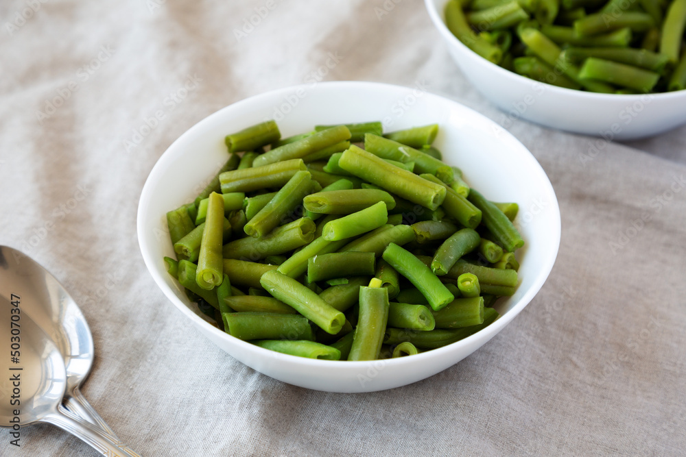 Steamed Green Beans in a White Bowl, side view. Steamed Green Beans in a White Bowl, side view.