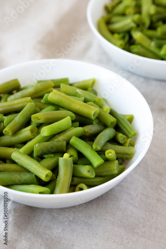 Steamed Green Beans in a White Bowl, low angle view.